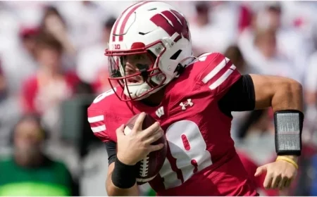Wisconsin Fans Brace for Tough Battle Against Michigan as They Wave the White Flag