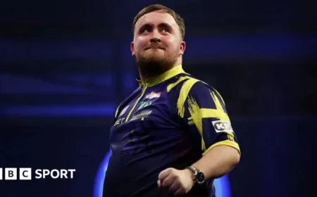 Littler Triumphs Over De Decker in Intense World Grand Prix Showdown