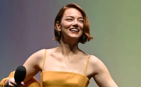 Emma Stone Embraces Taylor Swift’s Vibrant Showgirl Orange Style