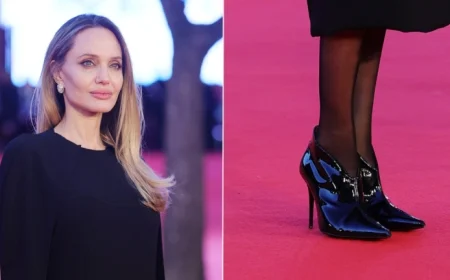 Angelina Jolie Dazzles in High-Gloss Patent Booties at Couture Premiere