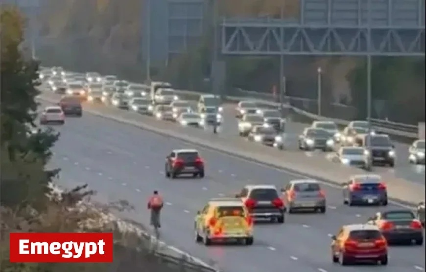 Baffling Scene as Reckless Food Delivery Cyclist Rides Along M4 During Rush Hour Before Police Intervene