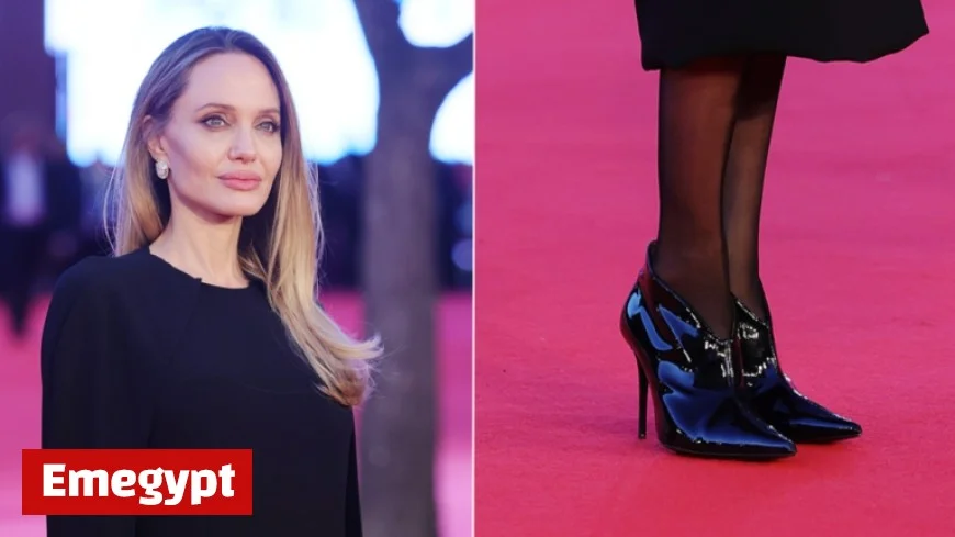 Angelina Jolie Dazzles in High-Gloss Patent Booties at Couture Premiere
