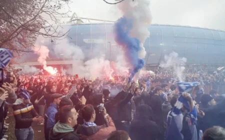 Team Arrives at Stadium Amidst Songs and Flares Creating a Vibrant Atmosphere