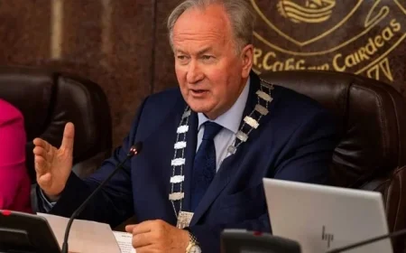 Kerry Mourns Jim Finucane with Condolence Books from County Council and ETB