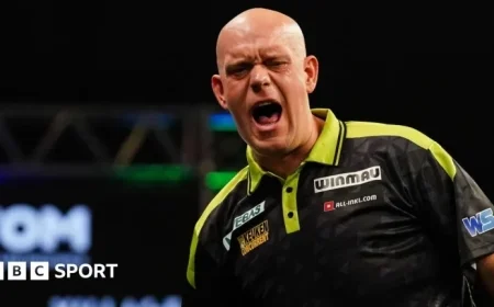 Grand Slam of Darts: Michael van Gerwen Narrowly Escapes Beau Greaves Upset While Luke Littler Clinches Victory