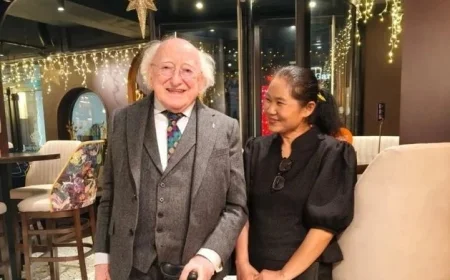 Michael D Higgins visits Galway Thai restaurant and poses with staff