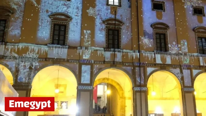 Watch History Come Alive: Clic Button Illuminates Piazza While Walls Display Our Story Amid Tight Street Security