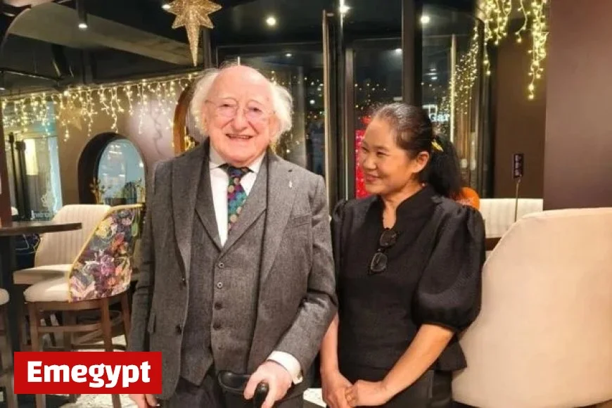 Michael D Higgins visits Galway Thai restaurant and poses with staff