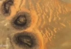 Sahara Sand Dunes Unveiled from Ancient ‘Black Mesas’ Visible from Space