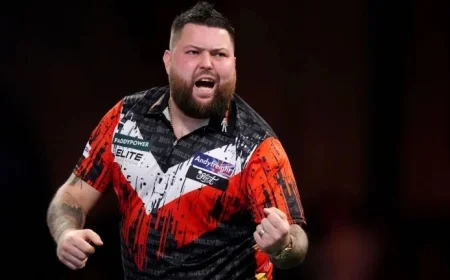 World Darts Championship: Michael Smith Receives Cortisone Injections for Ankle and Wrist Issues Before Lisa Ashton Clash