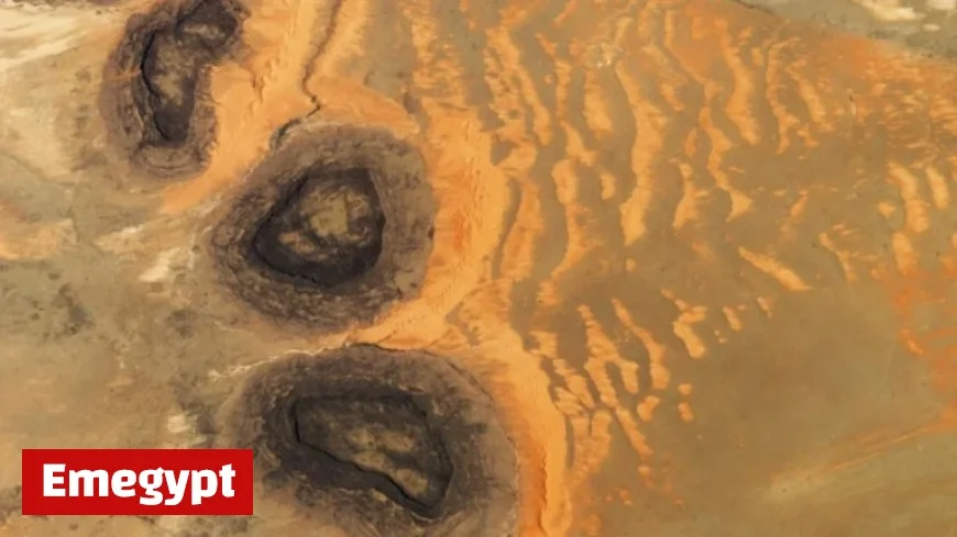 Paleozoic Black Mesas Create Rare Sahara Sand Dunes from Space